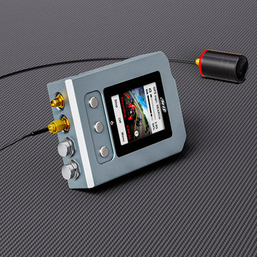 High-performance AIM SmartyCam 3 GP video camera capturing racing action on the track.